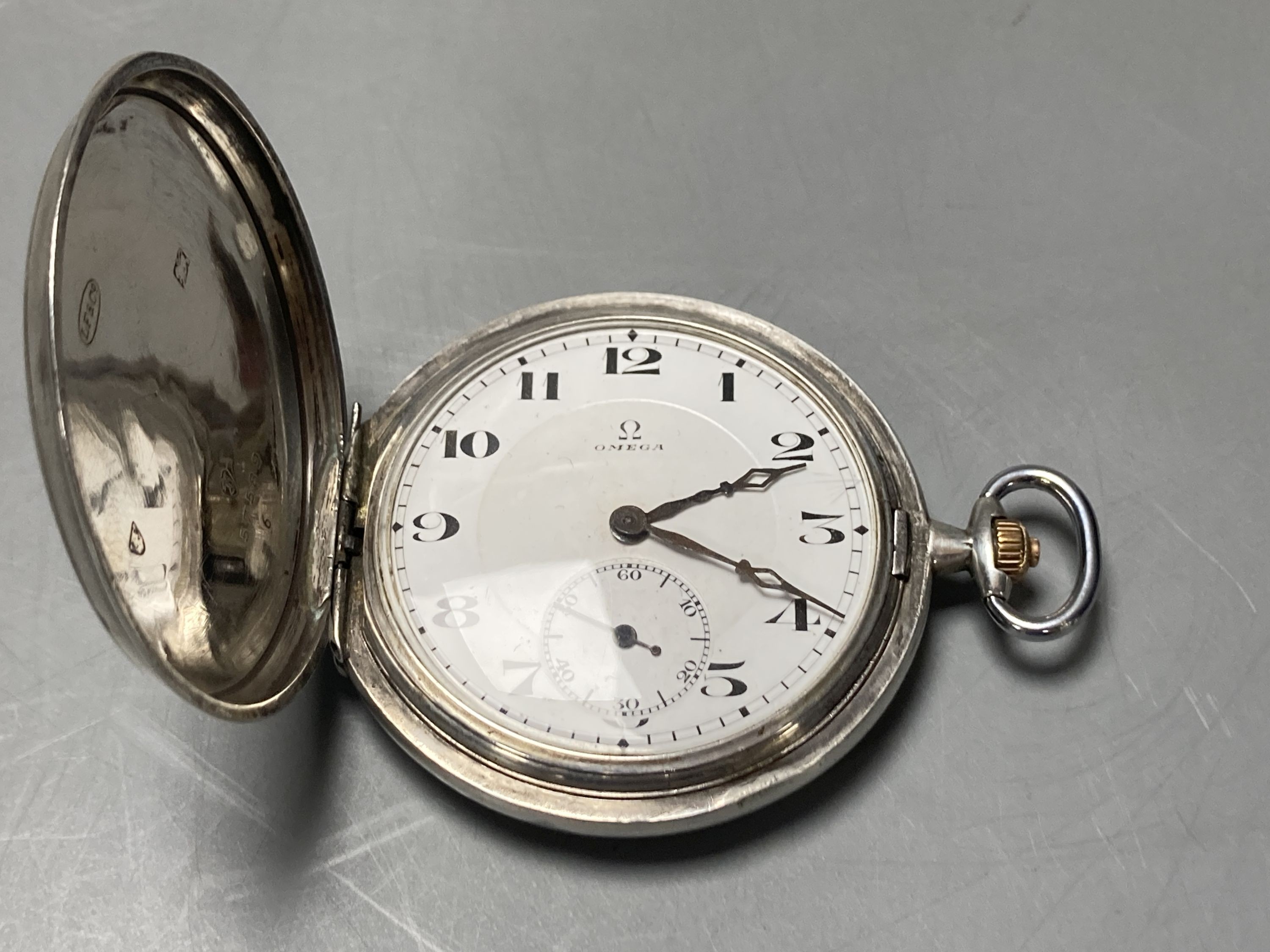 An Omega keyless silver hunter pocket watch in 900 standard case, lid associated.